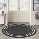 Nourison Essentials Indoor/Outdoor Solid Bordered Black Ivory 6' x Round Area Rug, Easy Cleaning, Non Shedding, Bed Room, Living Room, Dining Room, Backyard, Deck, Patio (6 Round)