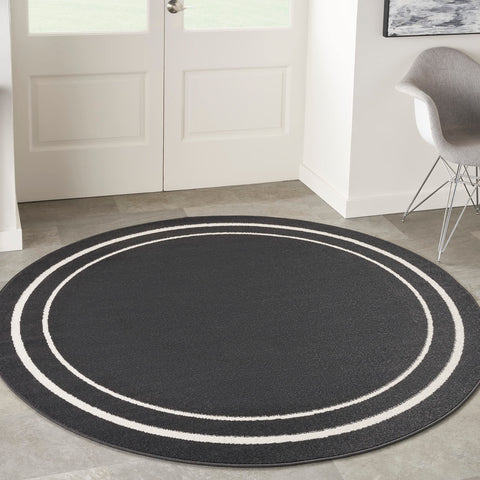 Nourison Essentials Indoor/Outdoor Solid Bordered Black Ivory 6' x Round Area Rug, Easy Cleaning, Non Shedding, Bed Room, Living Room, Dining Room, Backyard, Deck, Patio (6 Round)
